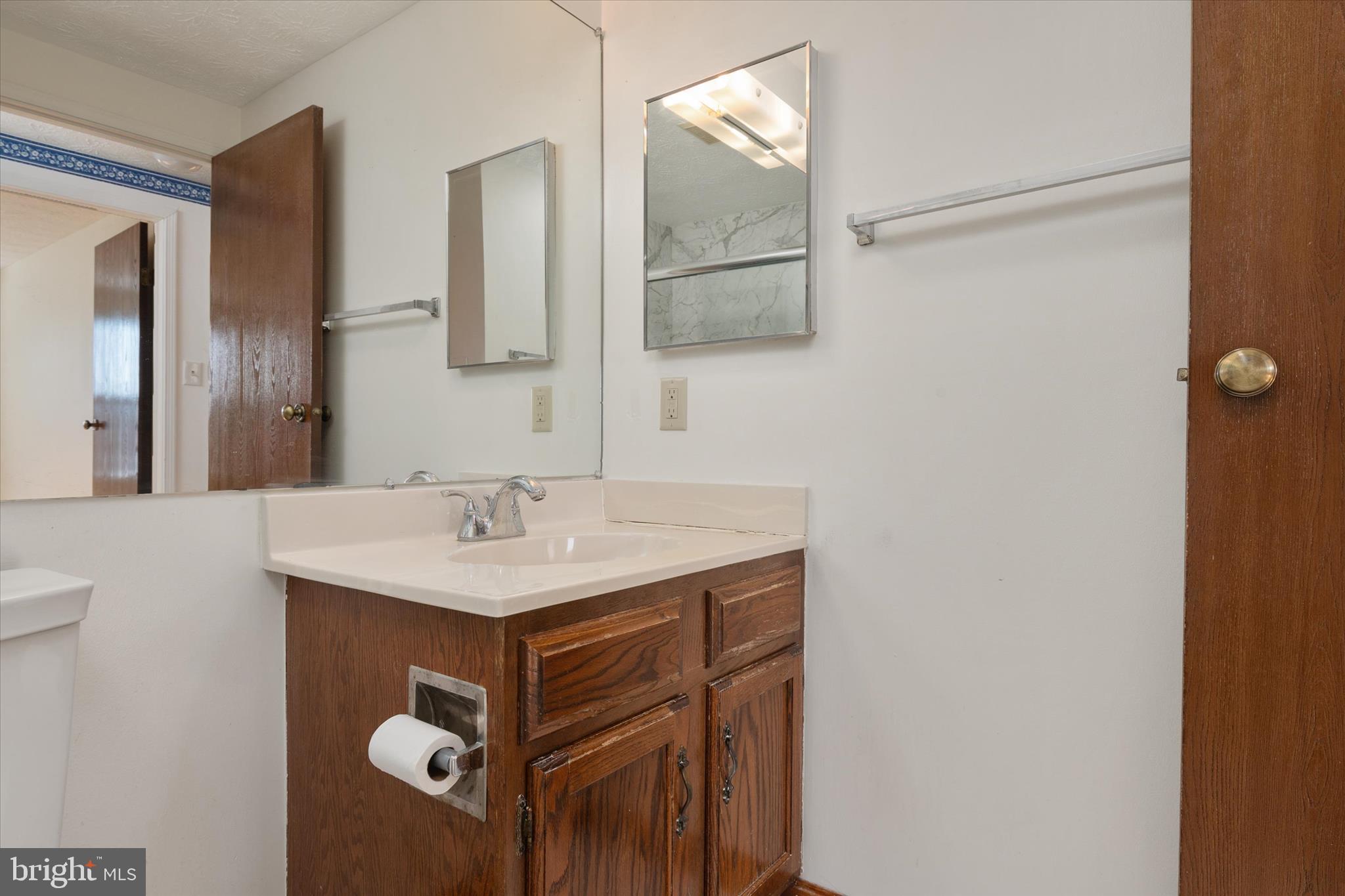 226 Compass Road Baltimore, MD 21221 - Photo 20 of 35 a bathroom with a sink and a mirror