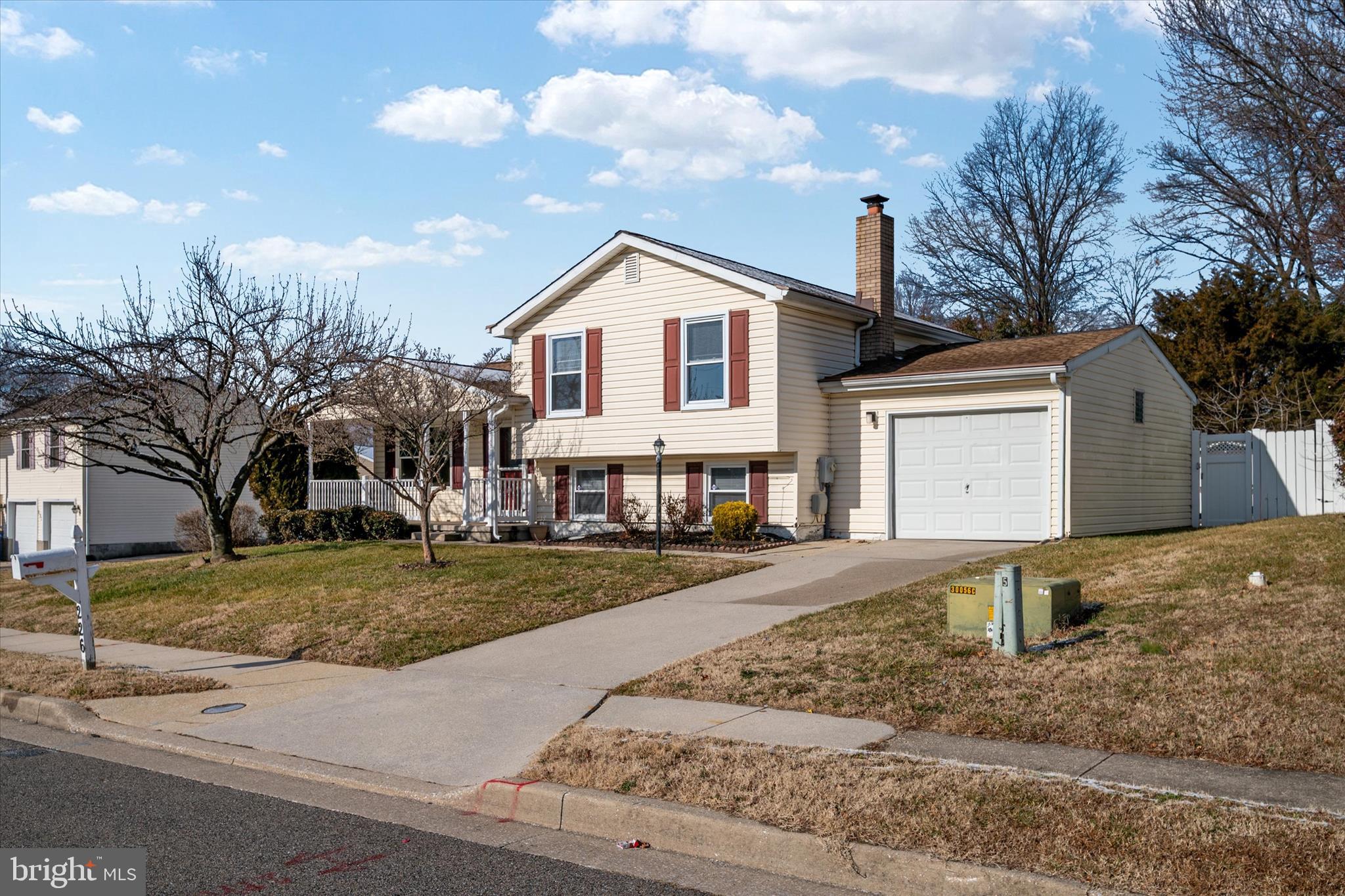 226 Compass Road Baltimore, MD 21221 - Photo 2 of 35 a front view of a house with a yard and garage