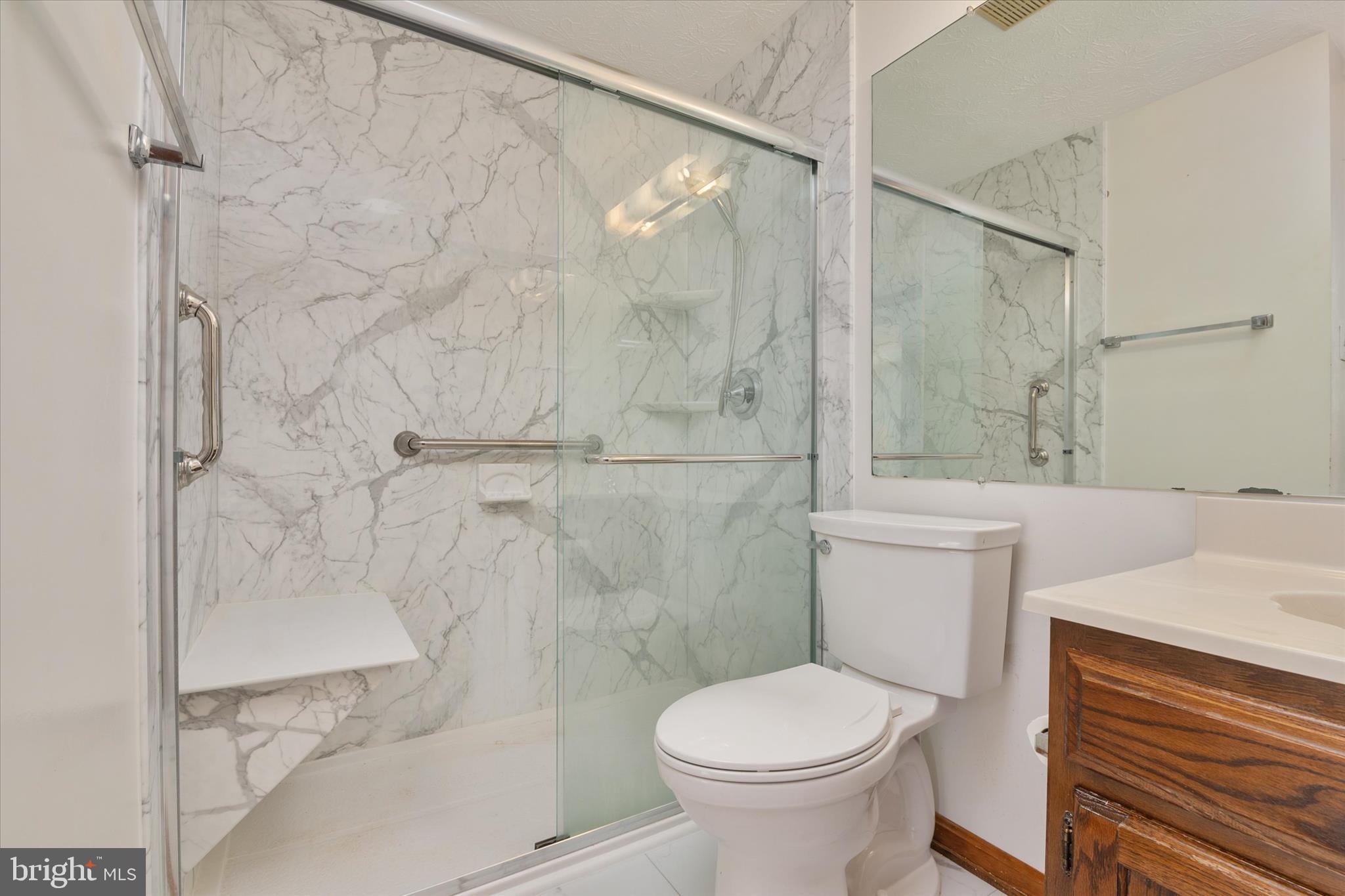 226 Compass Road Baltimore, MD 21221 - Photo 21 of 35 a white toilet sitting next to a bathroom sink