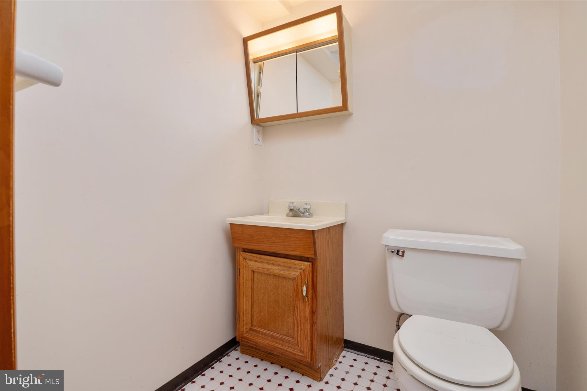226 Compass Road Baltimore, MD 21221 - Photo 28 of 35 a bathroom with a toilet and a sink