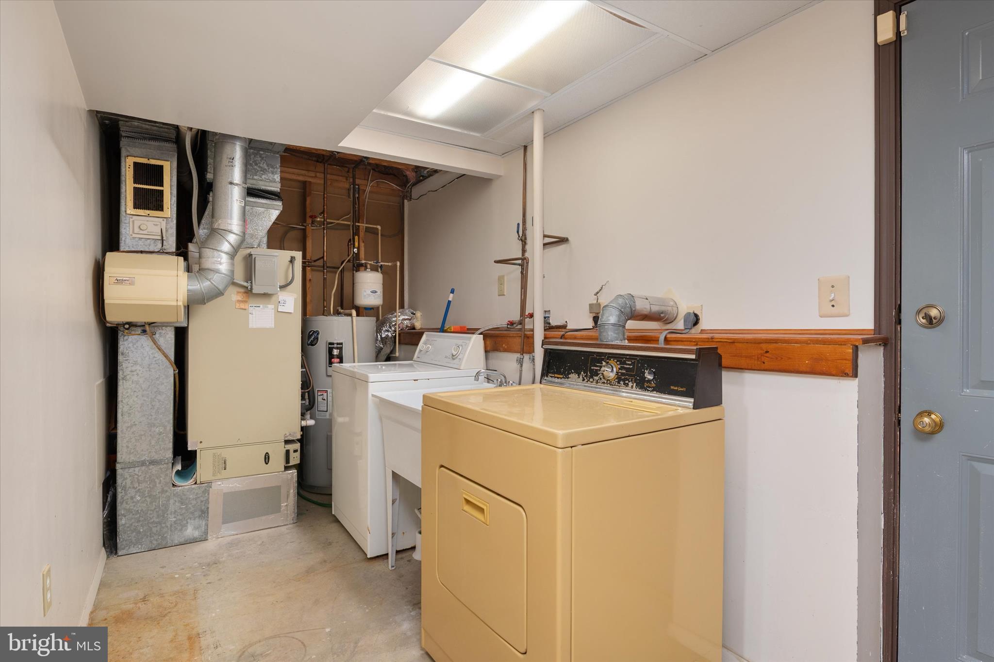226 Compass Road Baltimore, MD 21221 - Photo 29 of 35 a utility room with dryer and washer
