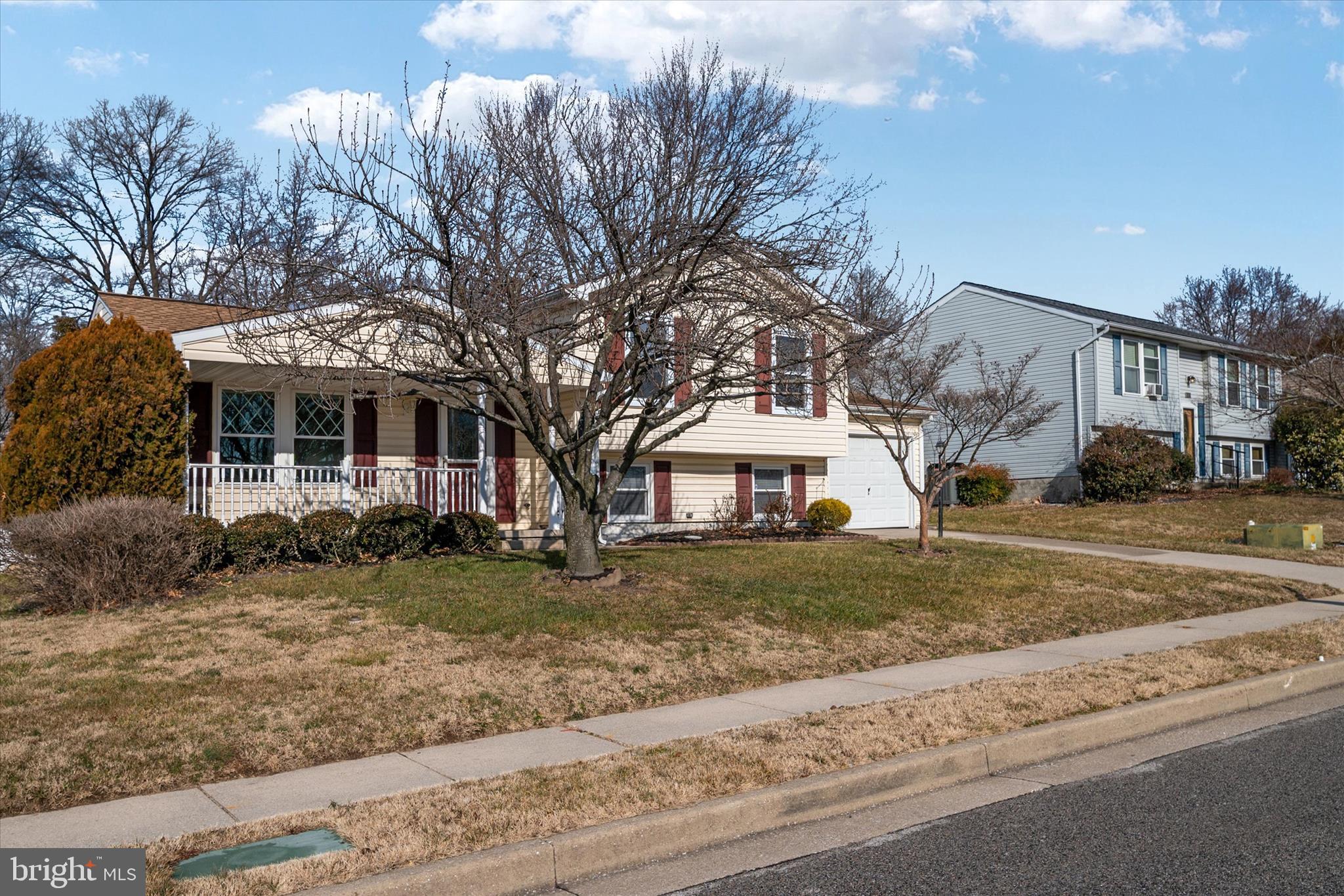 226 Compass Road Baltimore, MD 21221 - Photo 3 of 35 a front view of a house with a yard and garage