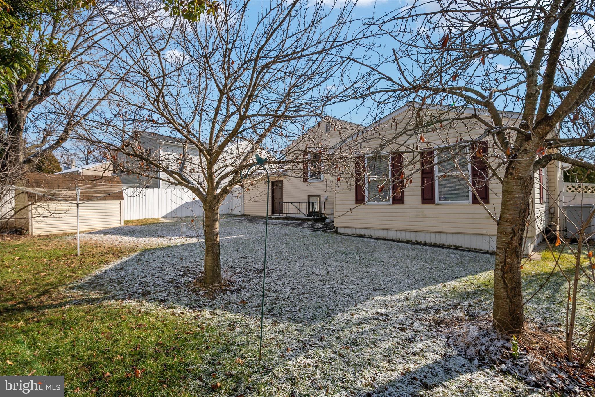 226 Compass Road Baltimore, MD 21221 - Photo 33 of 35 a house with trees in front of it