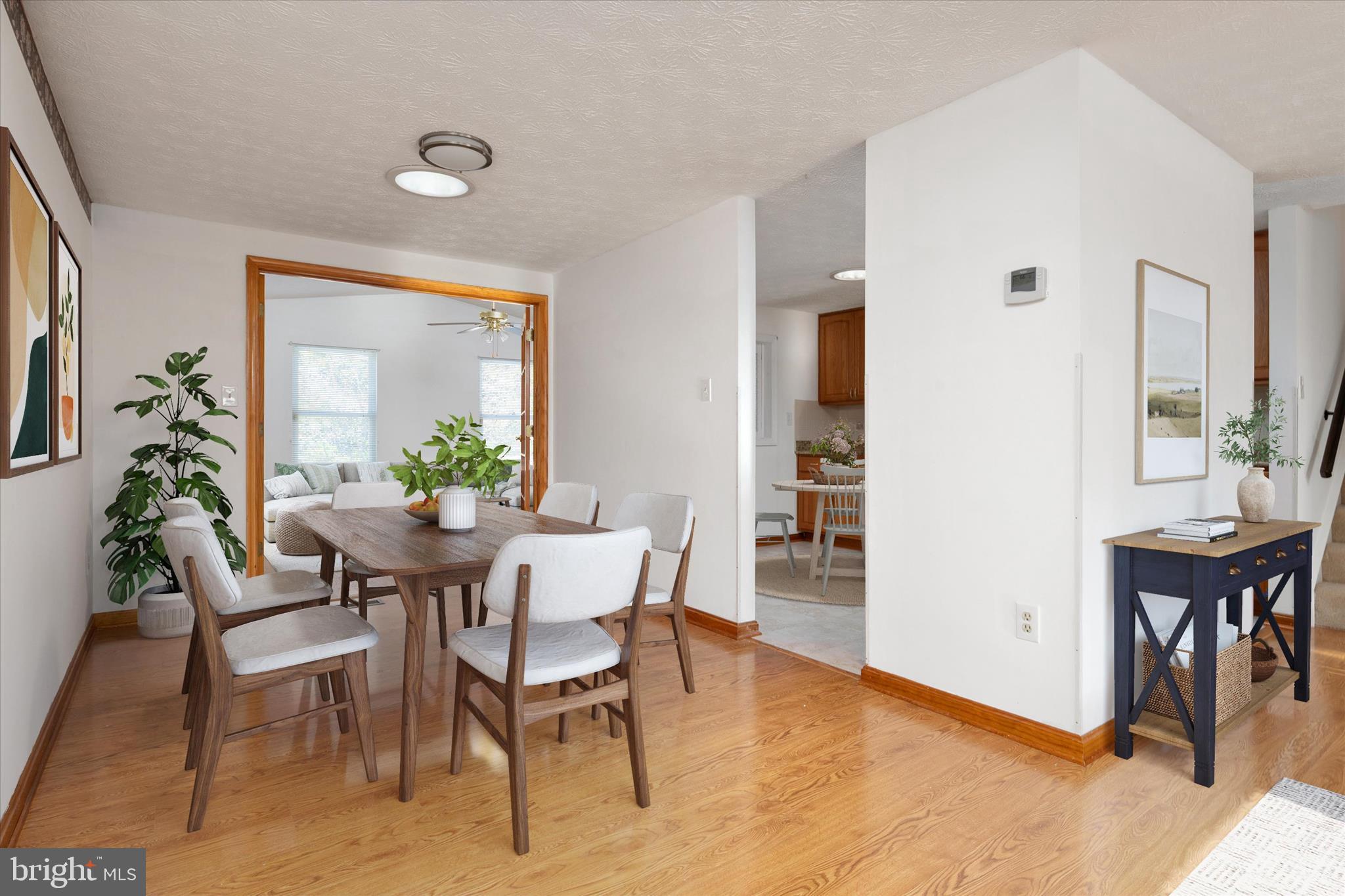 226 Compass Road Baltimore, MD 21221 - Photo 9 of 35 a view of a dining room with furniture and a potted plant