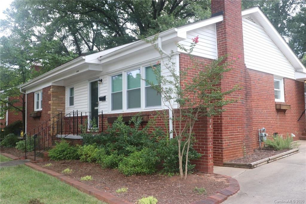 1100 Norland Road Charlotte, NC 28205 - Photo 2 of 13 a view of a brick house with a yard