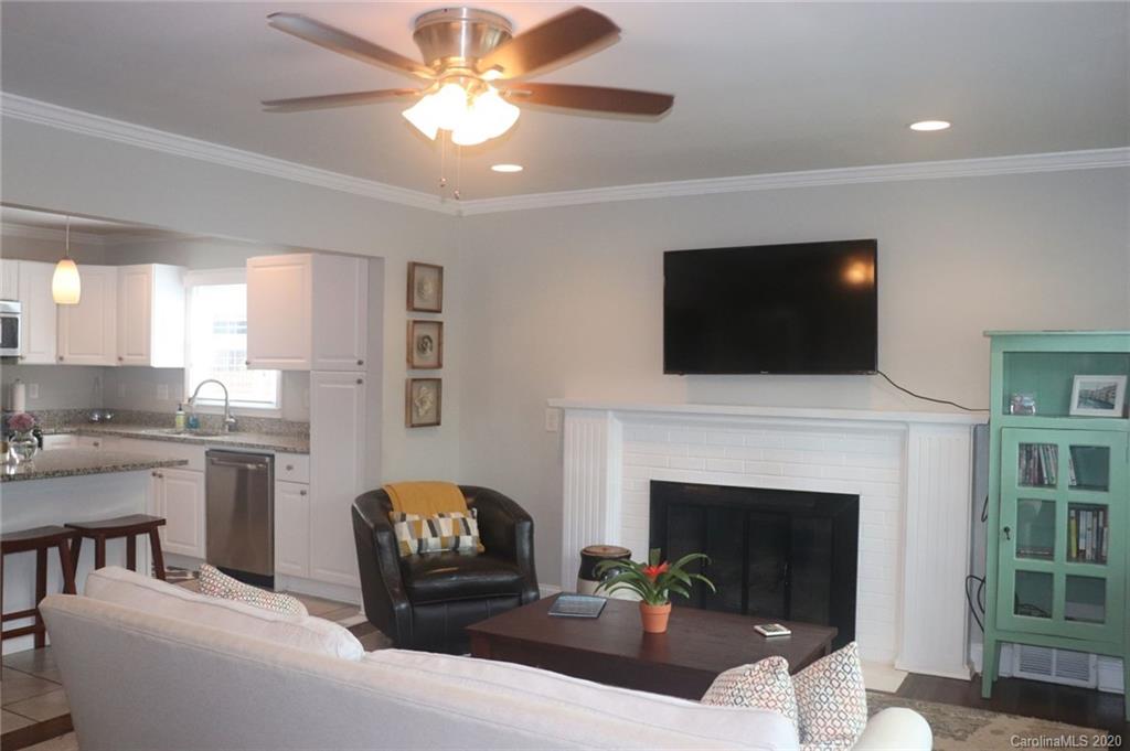 1100 Norland Road Charlotte, NC 28205 - Photo 5 of 13 a living room with furniture fireplace and flat screen tv