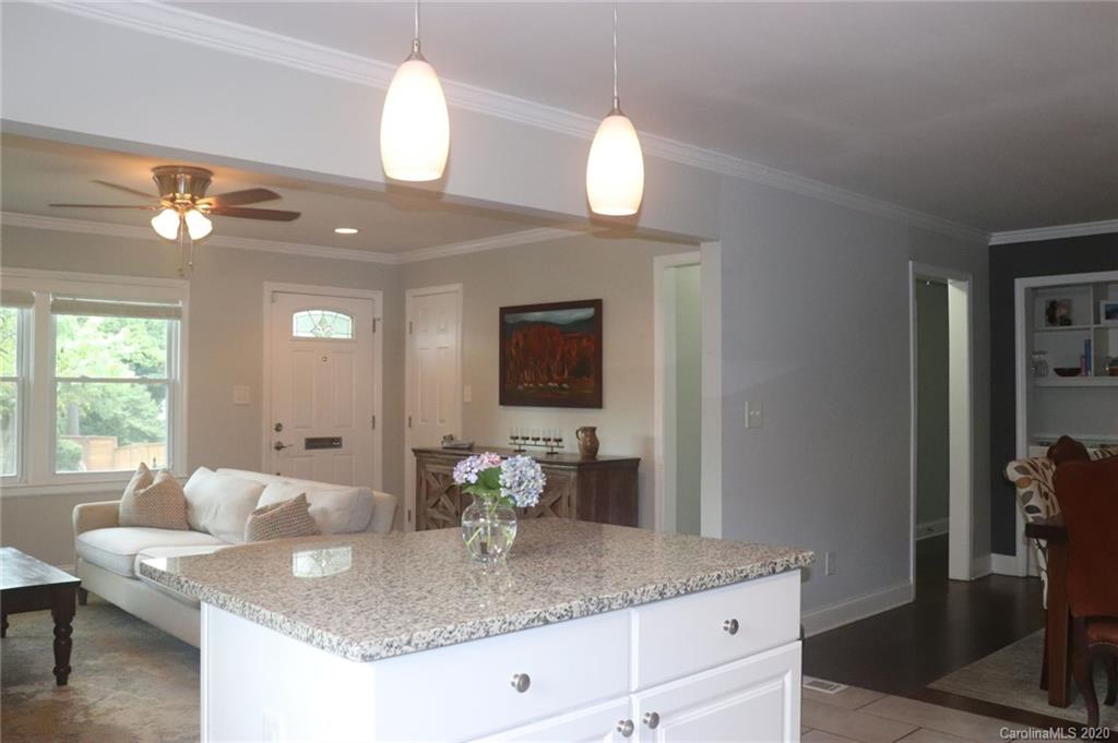 1100 Norland Road Charlotte, NC 28205 - Photo 6 of 13 a bathroom with a granite countertop sink and a mirror