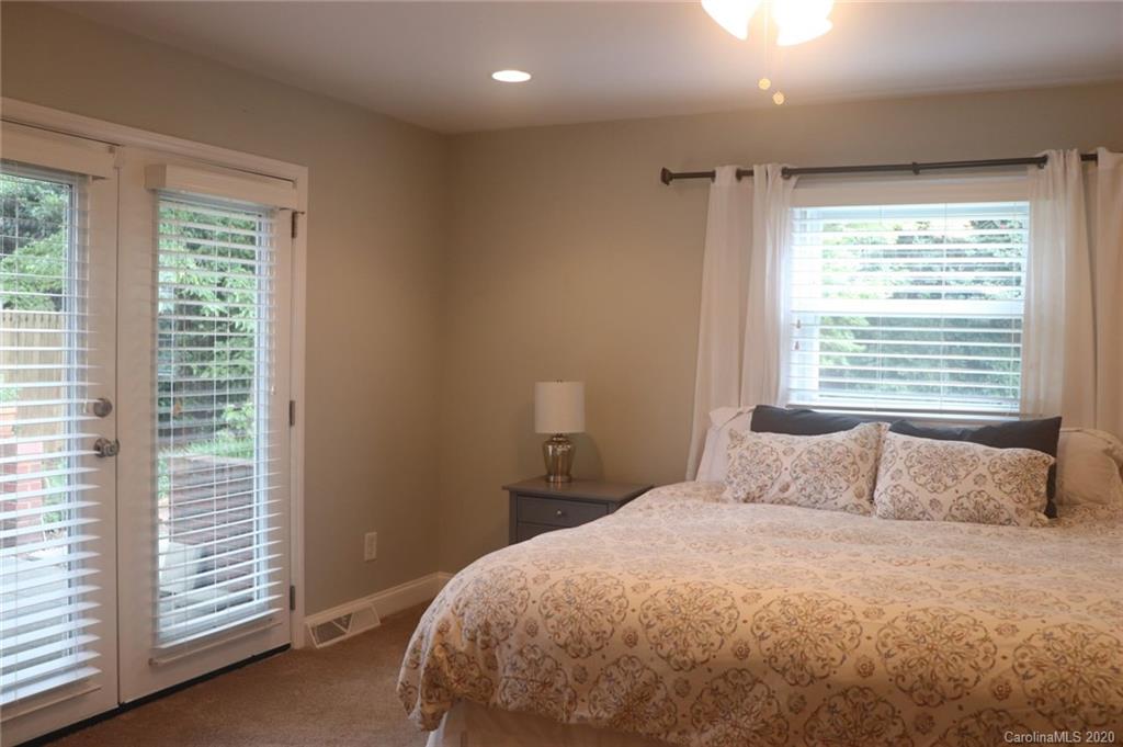 1100 Norland Road Charlotte, NC 28205 - Photo 7 of 13 a bedroom with a bed and a window