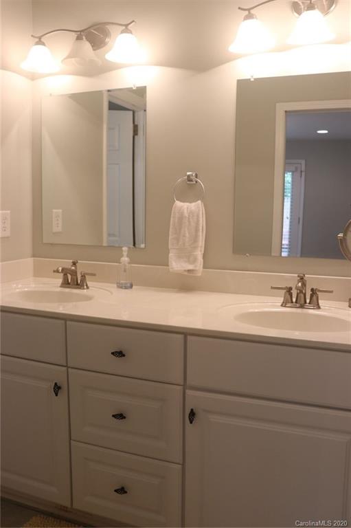 1100 Norland Road Charlotte, NC 28205 - Photo 8 of 13 a bathroom with a sink and a mirror
