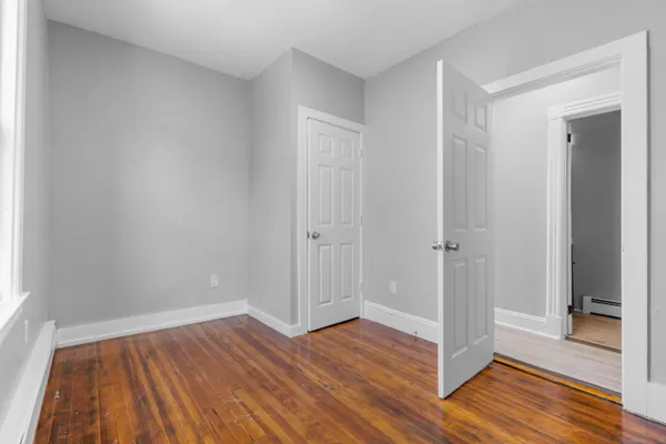 a white toilet sitting next to a shower