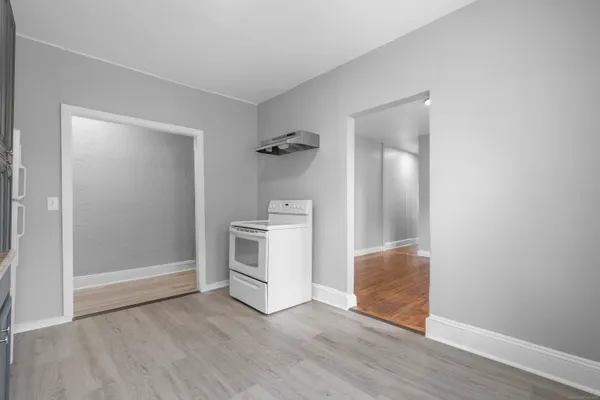 a view of an empty room and fire place