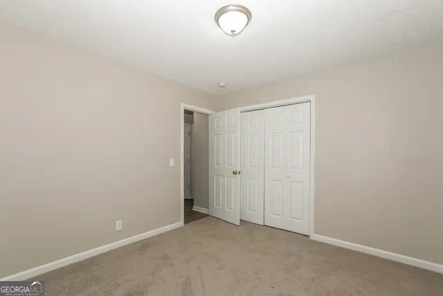 a view of a room with racks on the wall