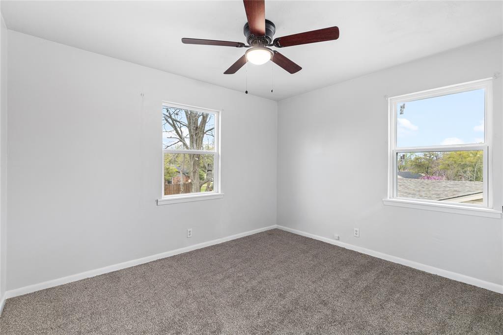 2806 North Ricketts Street Sherman, TX 75092 - Photo 19 of 24 Empty room with carpet floors and a ceiling fan