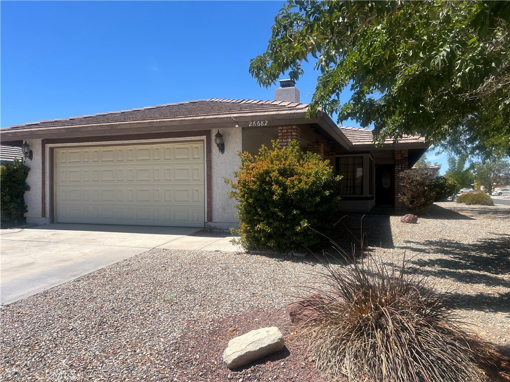 26682 Mainsail Lane Helendale, CA 92342 - Photo 4 of 13 a front view of a house with garden