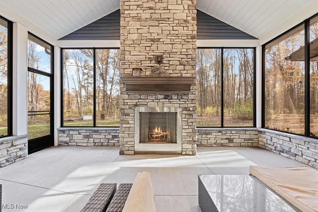 9340 Yale Road Diamond, OH 44412 - Photo 21 of 50 3-seasons patio featuring an outdoor, wood-burning, stone fireplace (never used) and upgraded screens