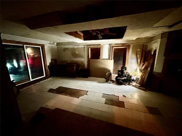 a view of a livingroom with furniture and a flat screen tv