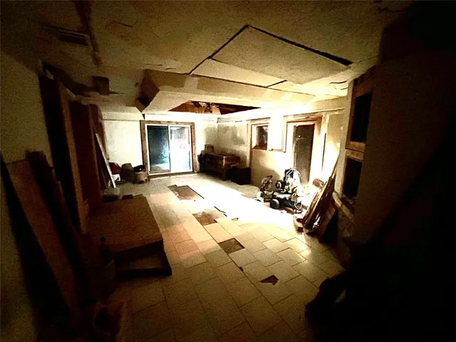 a view of living room with furniture and a window