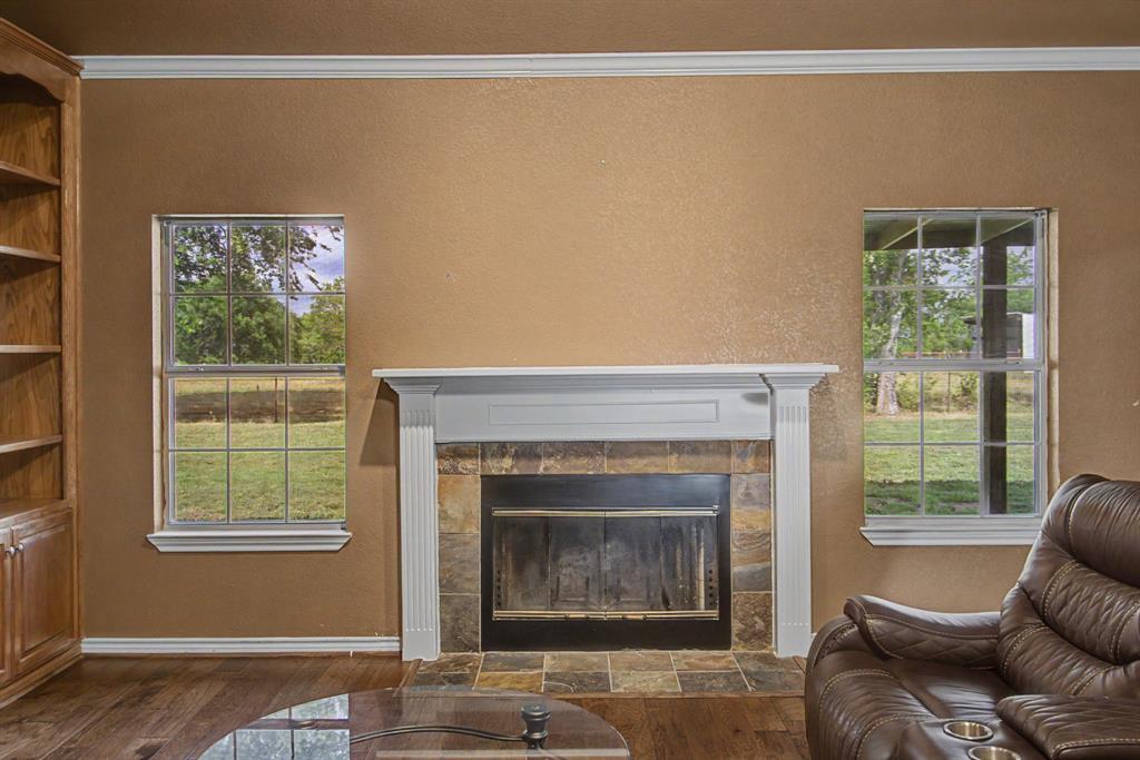 483 Christy Kay Lane Rhome, TX 76078 - Photo 10 of 40 a living room with furniture and a fireplace