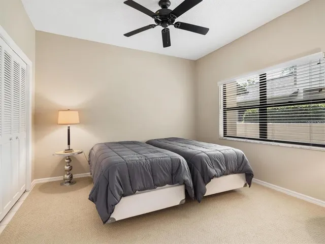 a spacious bedroom with a bed and window