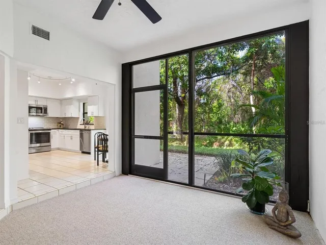 a view of kitchen with furniture and floor to ceiling window