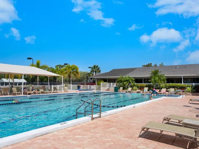 a view of a swimming pool with a patio