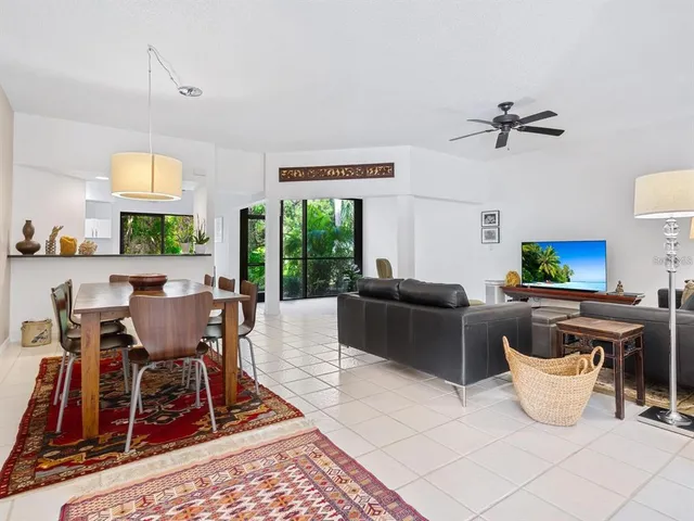 a living room with furniture a window and a table