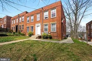 a view of a building with a yard