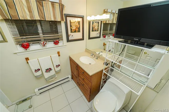 a bathroom with a sink mirror and a bathtub