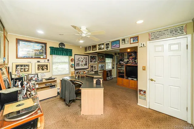 a view of a living room a dining room wooden floor and a window