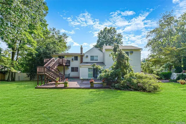 a view of a house with a back yard