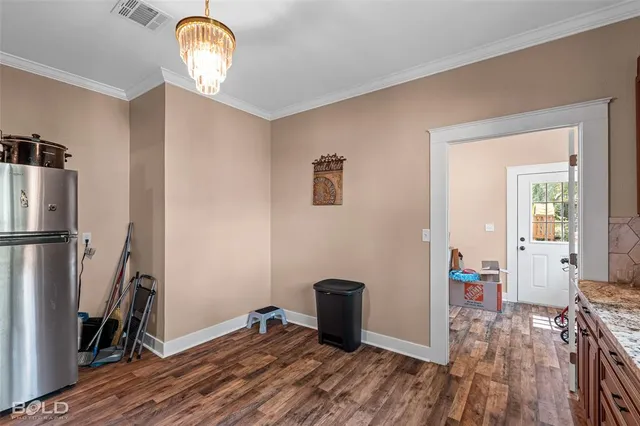 a room with furniture a rug toys and windows