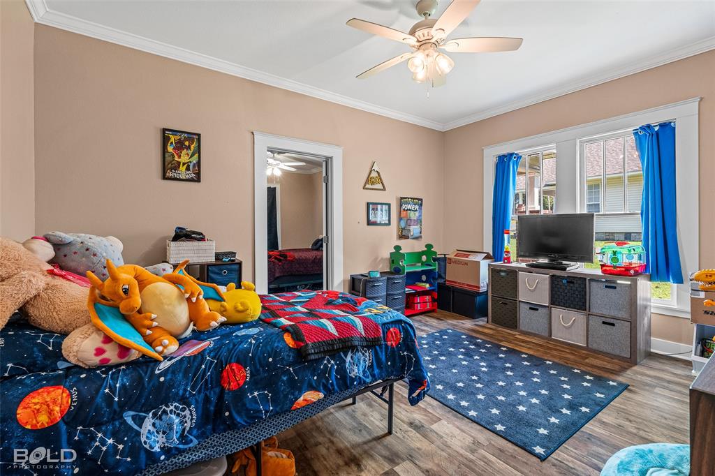 508 Chandler Street Minden, LA 71055 - Photo 28 of 35 a bedroom with furniture and a flat screen tv