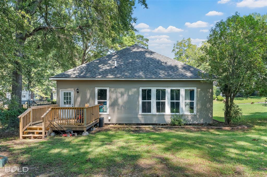 508 Chandler Street Minden, LA 71055 - Photo 32 of 35 a view of backyard with a garden and entertaining space