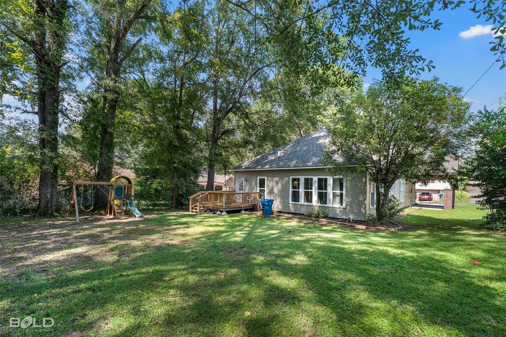 508 Chandler Street Minden, LA 71055 - Photo 33 of 35 a house view with a sitting space and garden