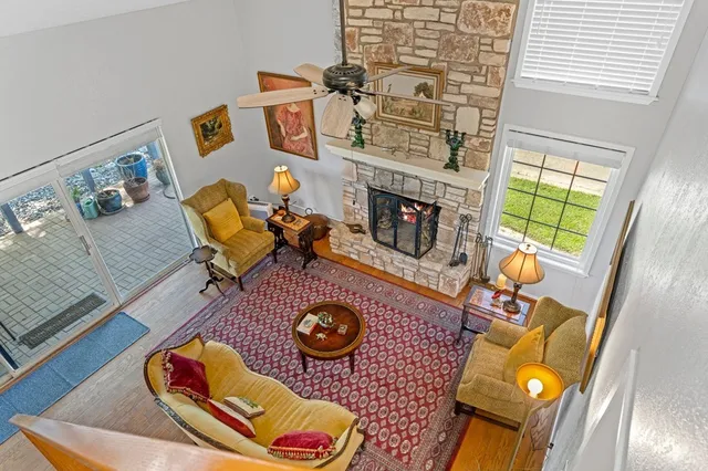 a living room with furniture and a fireplace