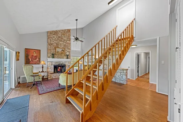 a view of entryway and hall with wooden floor