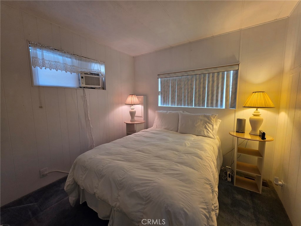 20806 Gridley Road, Unit 52 Lakewood, CA 90715 - Photo 15 of 51 a bedroom with a bed and dresser