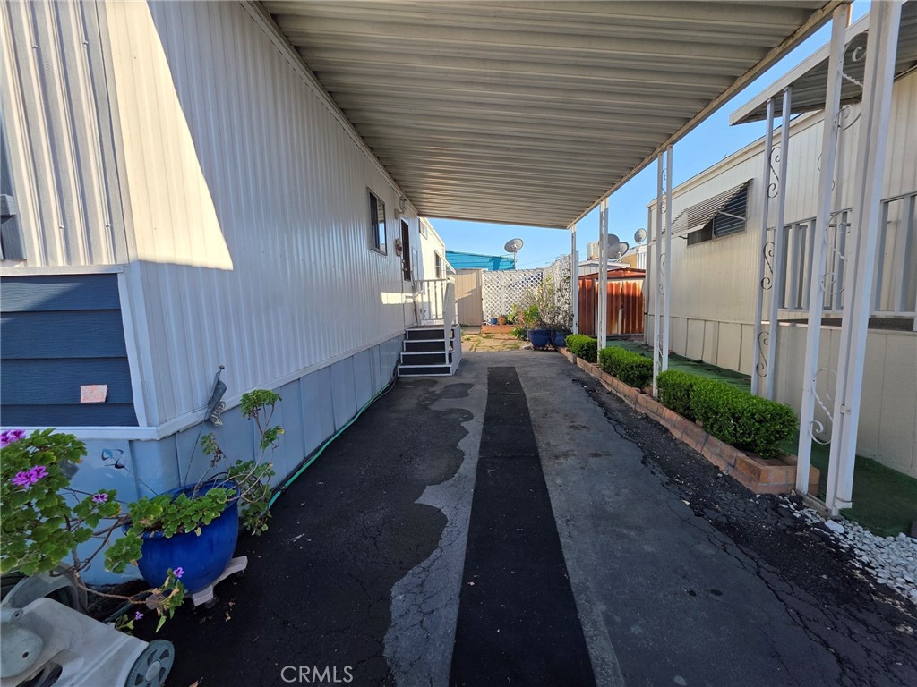 20806 Gridley Road, Unit 52 Lakewood, CA 90715 - Photo 17 of 51 a view of a backyard with potted plants