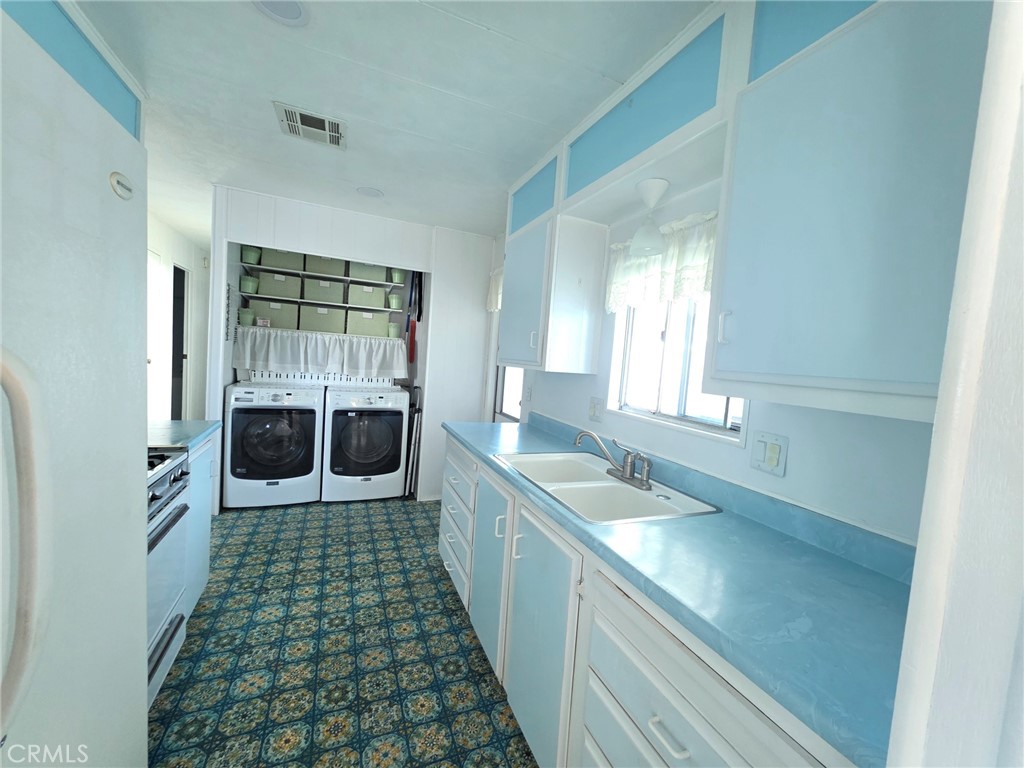 20806 Gridley Road, Unit 52 Lakewood, CA 90715 - Photo 29 of 51 a bathroom with a sink a large mirror and a shower