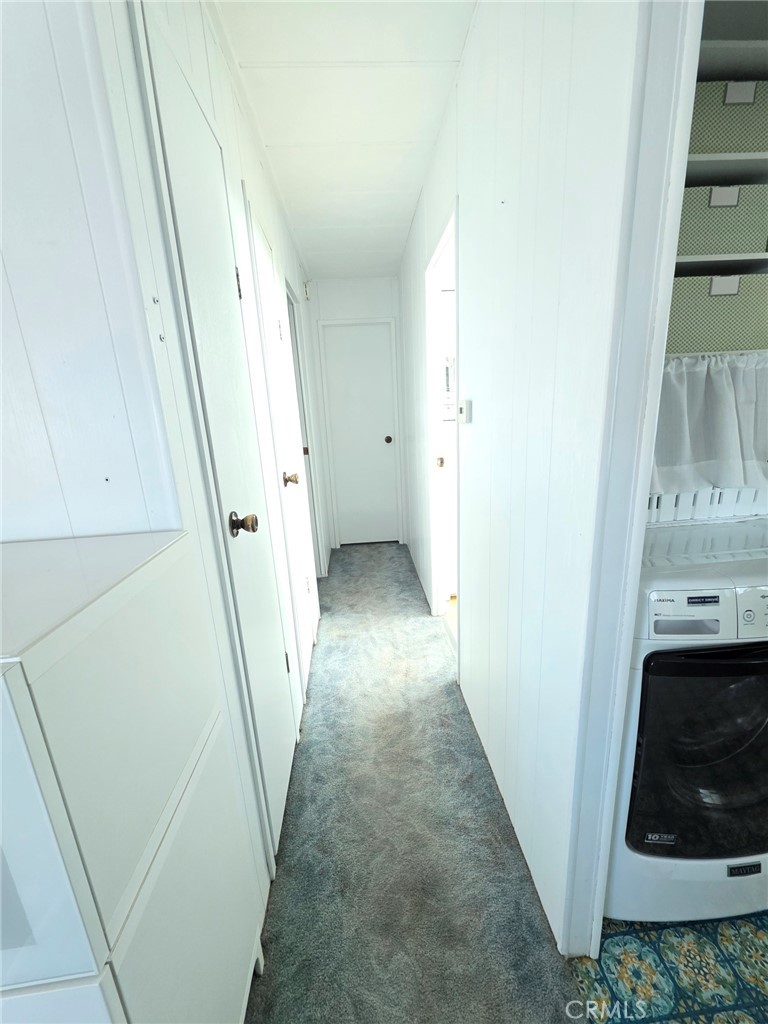 20806 Gridley Road, Unit 52 Lakewood, CA 90715 - Photo 32 of 51 a view of a hallway to rooms and stairs