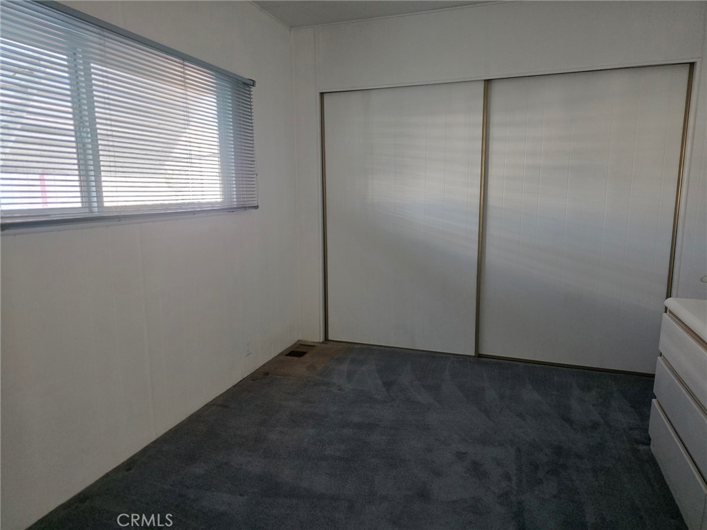 20806 Gridley Road, Unit 52 Lakewood, CA 90715 - Photo 38 of 51 an empty room with a empty space and window