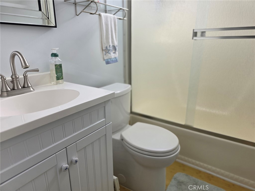 20806 Gridley Road, Unit 52 Lakewood, CA 90715 - Photo 40 of 51 a bathroom with a sink a toilet and shower