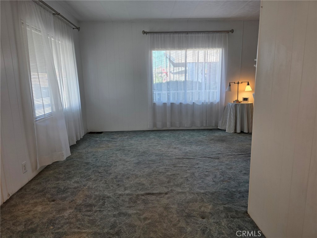 20806 Gridley Road, Unit 52 Lakewood, CA 90715 - Photo 43 of 51 an empty room with windows