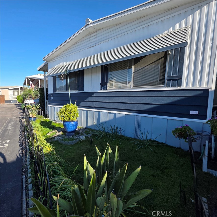 20806 Gridley Road, Unit 52 Lakewood, CA 90715 - Photo 5 of 51 a view of a backyard with plants