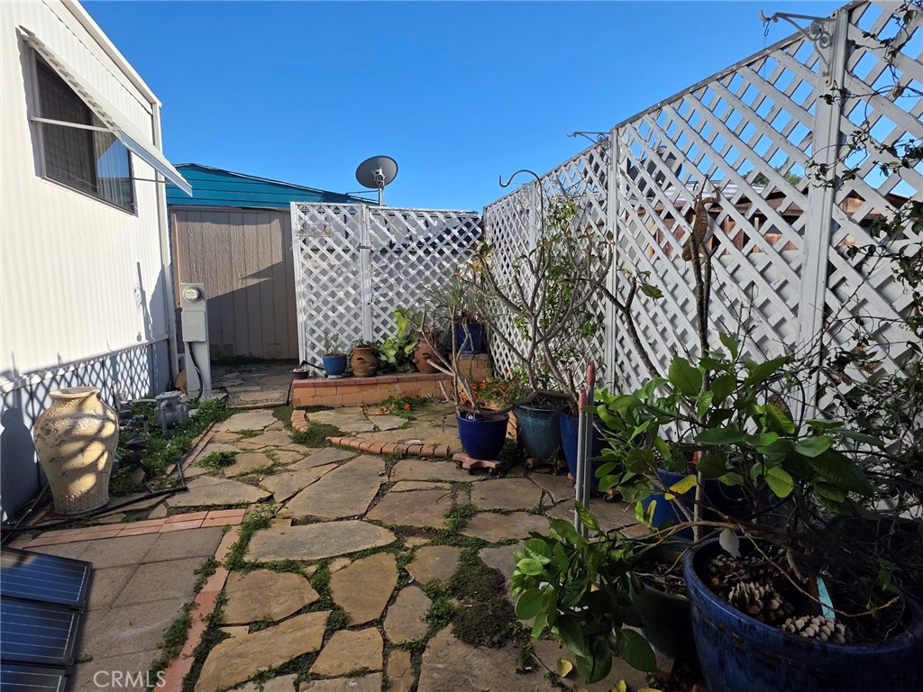 20806 Gridley Road, Unit 52 Lakewood, CA 90715 - Photo 8 of 51 a front view of a house with garden