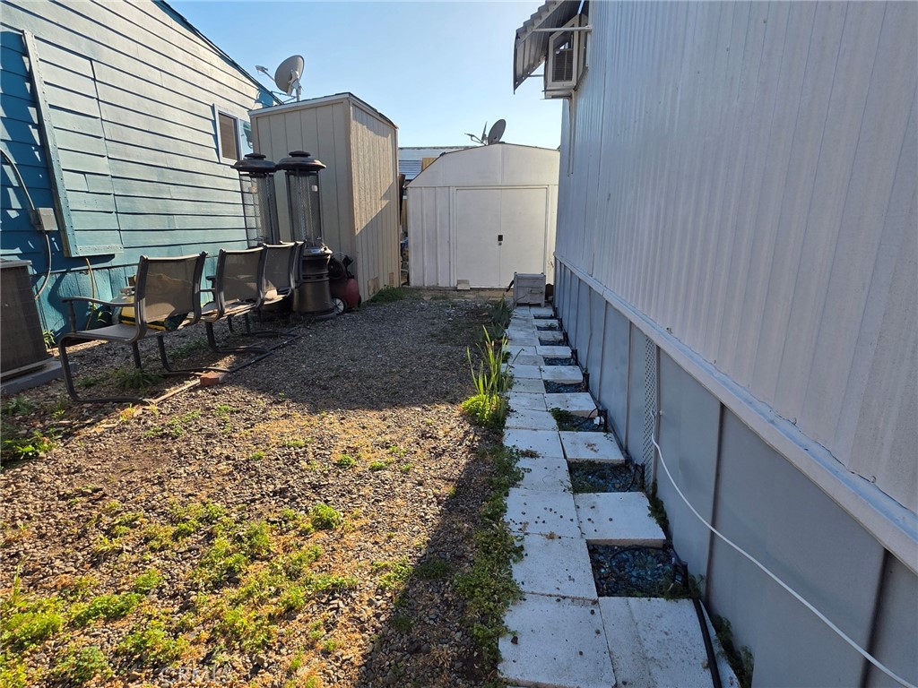 20806 Gridley Road, Unit 52 Lakewood, CA 90715 - Photo 10 of 51 a view of a house with wooden fence