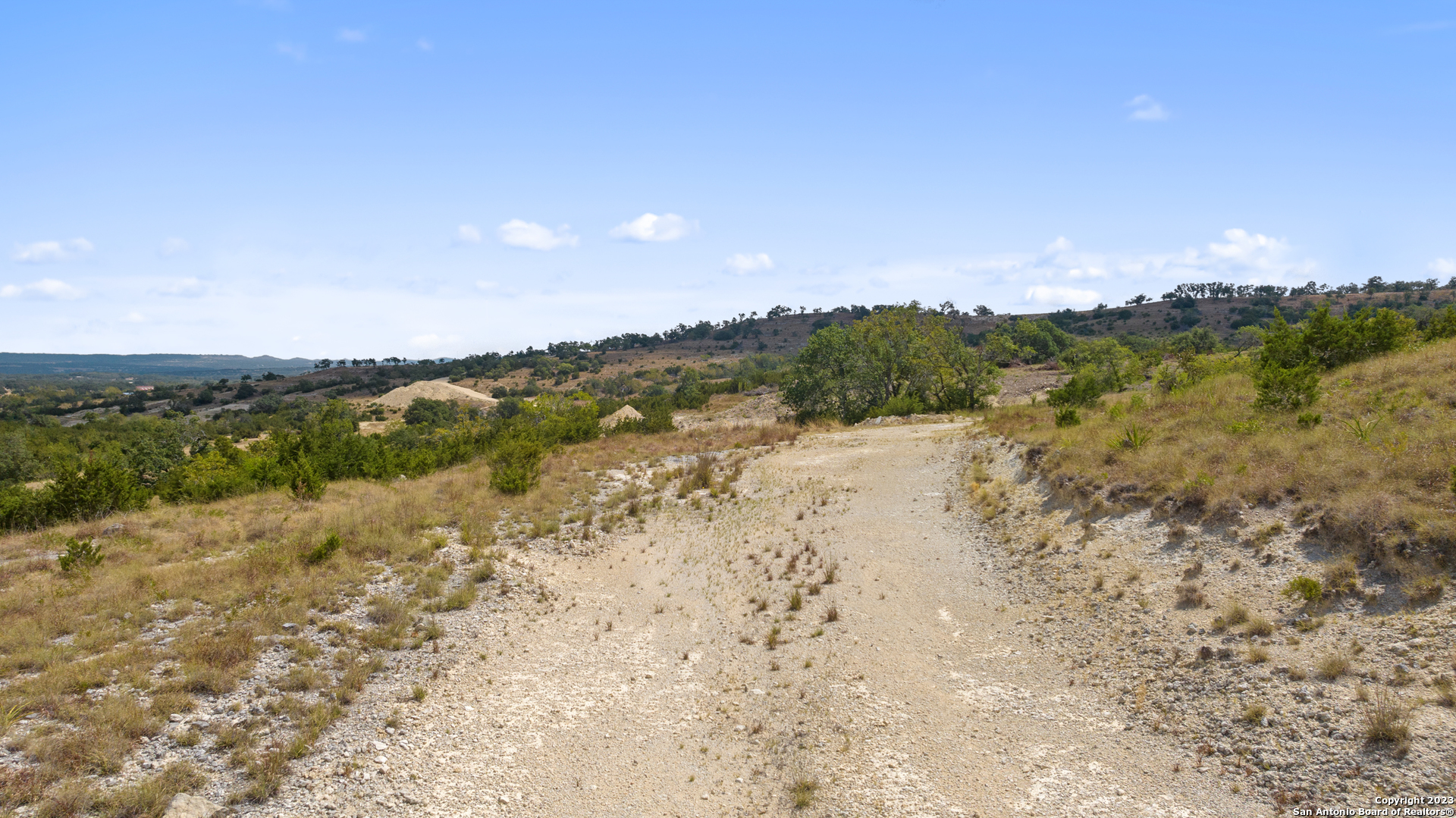 120 Falling Oak Trail Blanco, TX 78606 - Photo 11 of 15 a view of lake with mountain