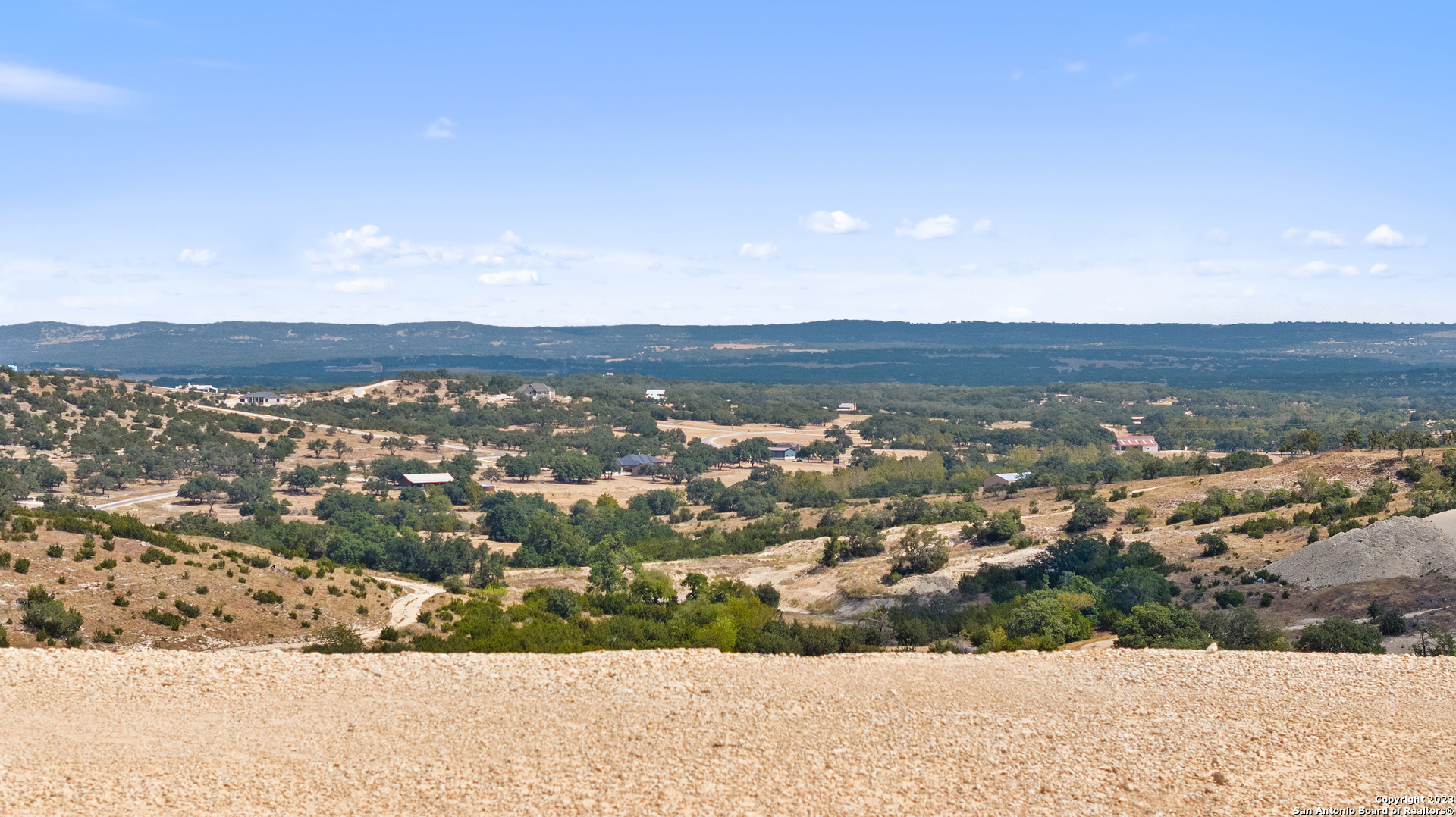 120 Falling Oak Trail Blanco, TX 78606 - Photo 14 of 15 an aerial view of residential houses with outdoor space and trees