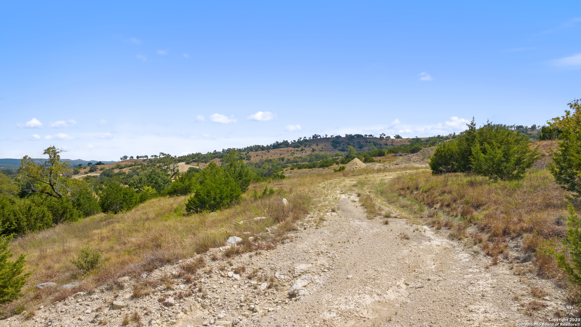 120 Falling Oak Trail Blanco, TX 78606 - Photo 10 of 15 a view of lake with mountain