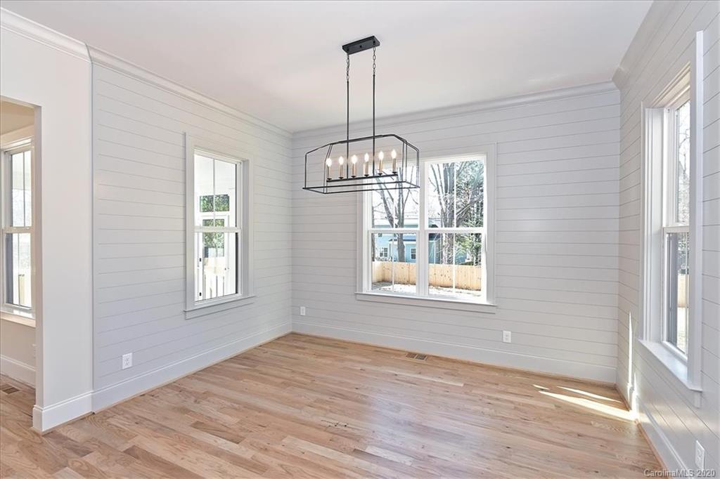 608 Marsh Road Charlotte, NC 28209 - Photo 17 of 31 a view of an empty room with wooden floor and a window